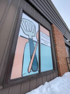 PERFORATED WINDOW GRAPHICS ON A COMMERCIAL BUILDING